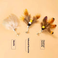 Three steel wire cat toy replacement heads with flying insect designs in distinct colour combinations