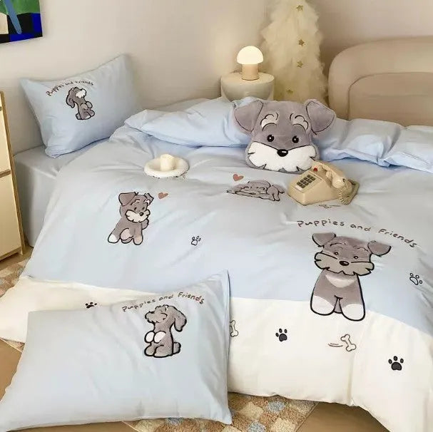 Schnauzer dog cartoon embroidery design on a light-coloured cotton quilt cover and pillowcase from a four-piece bedding set.