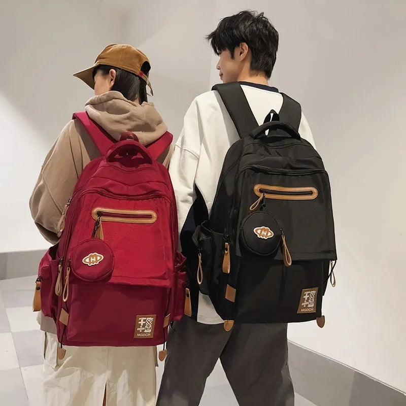 Nylon school backpack with curved shoulder straps in multiple colour options including khaki and red