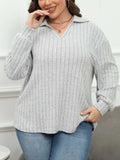 Women's plus size grey polo collar fleece shirt with lantern sleeves on a hanger.