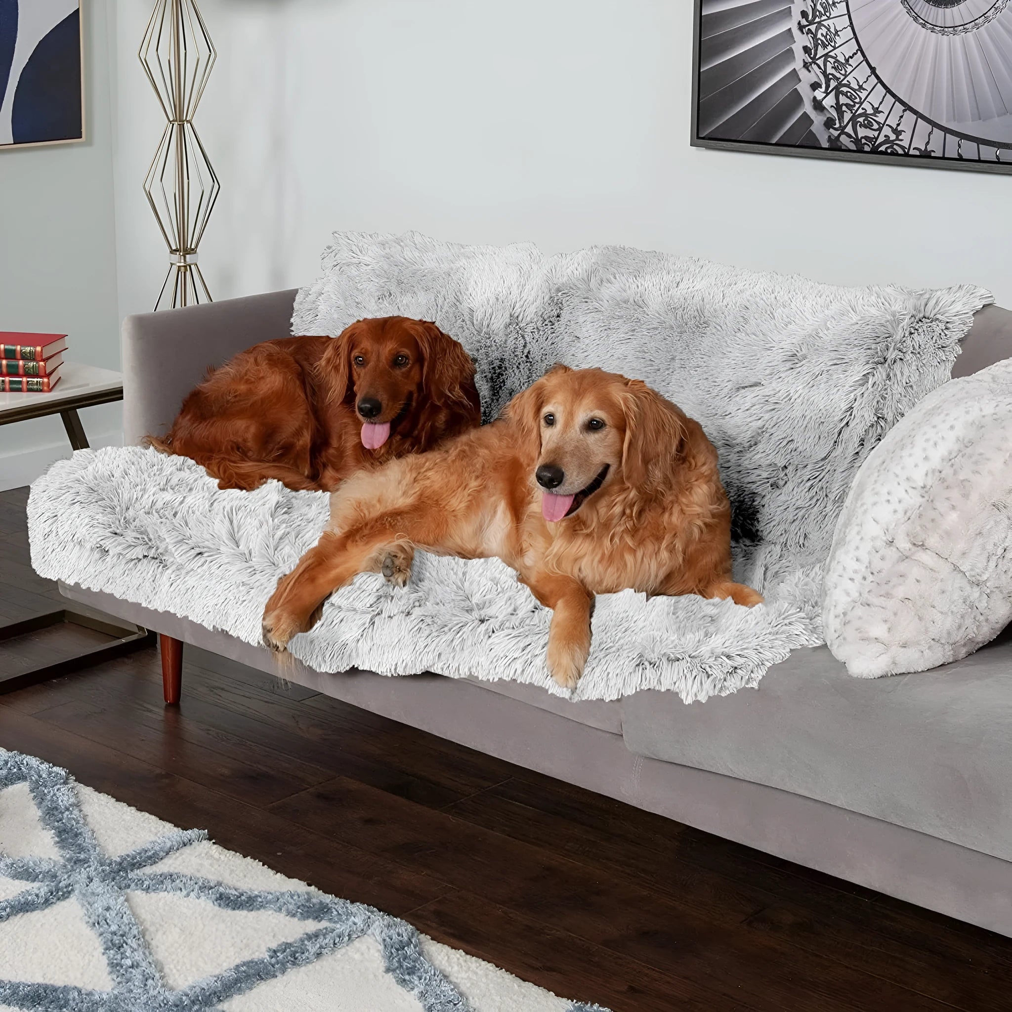Plush waterproof dog cushion in dark grey, shown in a large size on a wooden floor.