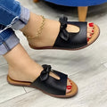Black ladies sandals with a fish mouth design and a decorative bow on the artificial PU upper.