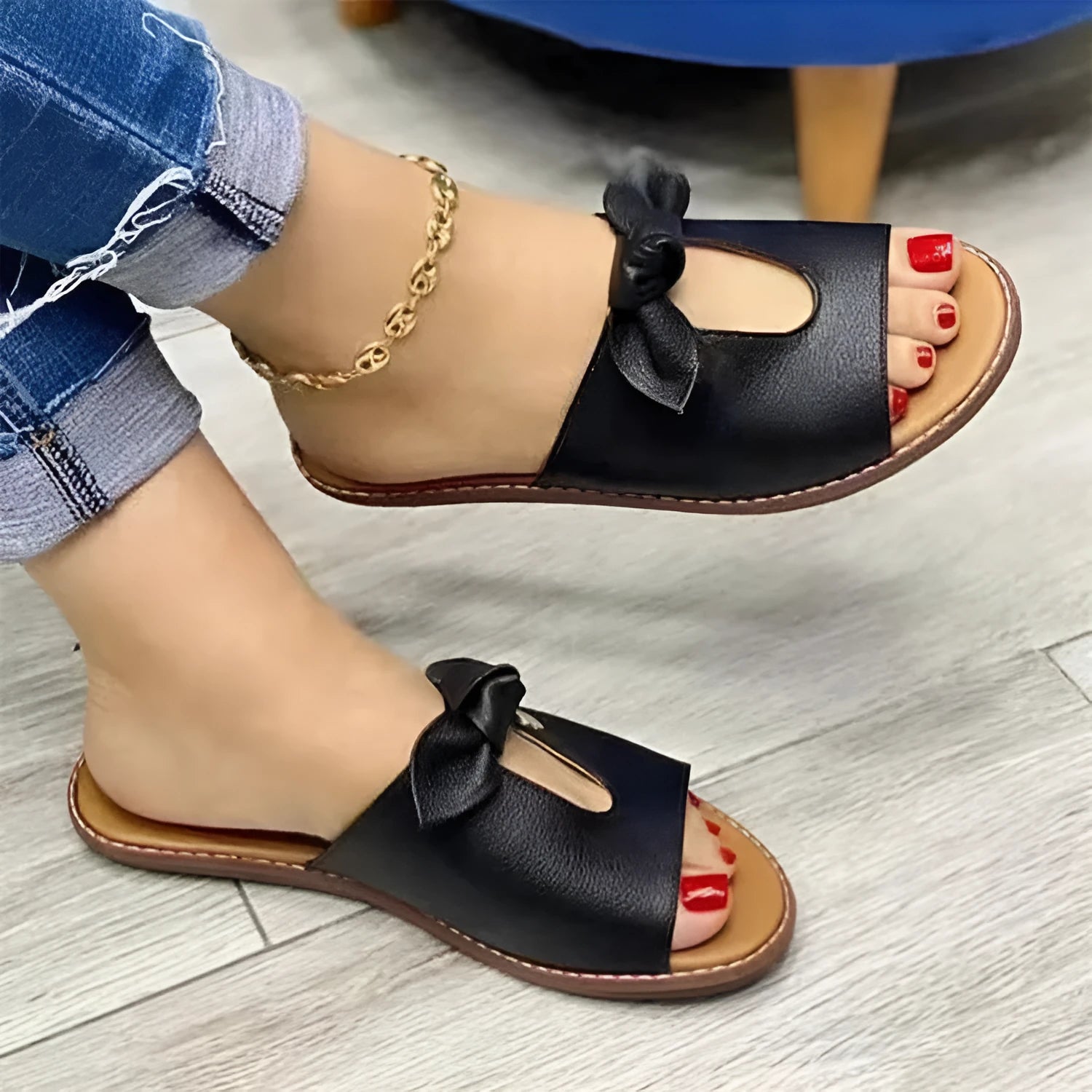Black ladies sandals with a fish mouth design and a decorative bow on the artificial PU upper.
