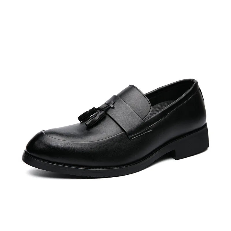 Men's black slip-on business casual shoes with a tassel detail and rubber sole.
