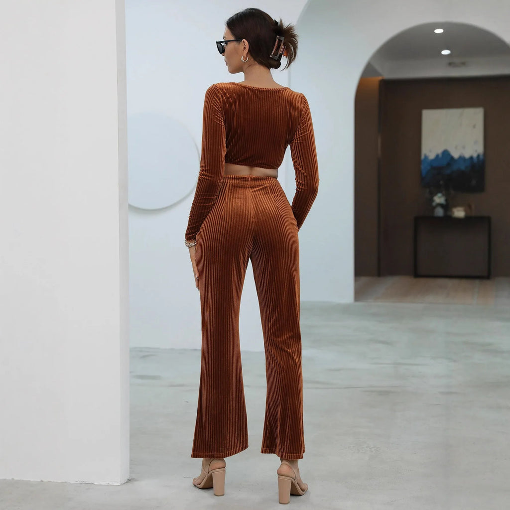 Caramel coloured long sleeve sweater and trousers casual set laid flat.