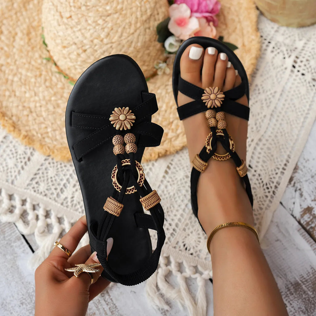 Black ethnic style women's flat beach sandals with beaded weave decoration and elastic band closure