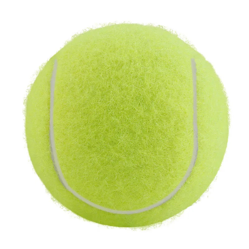 6.3 cm diameter solid rubber dog tennis ball in assorted bright colours on a green lawn.