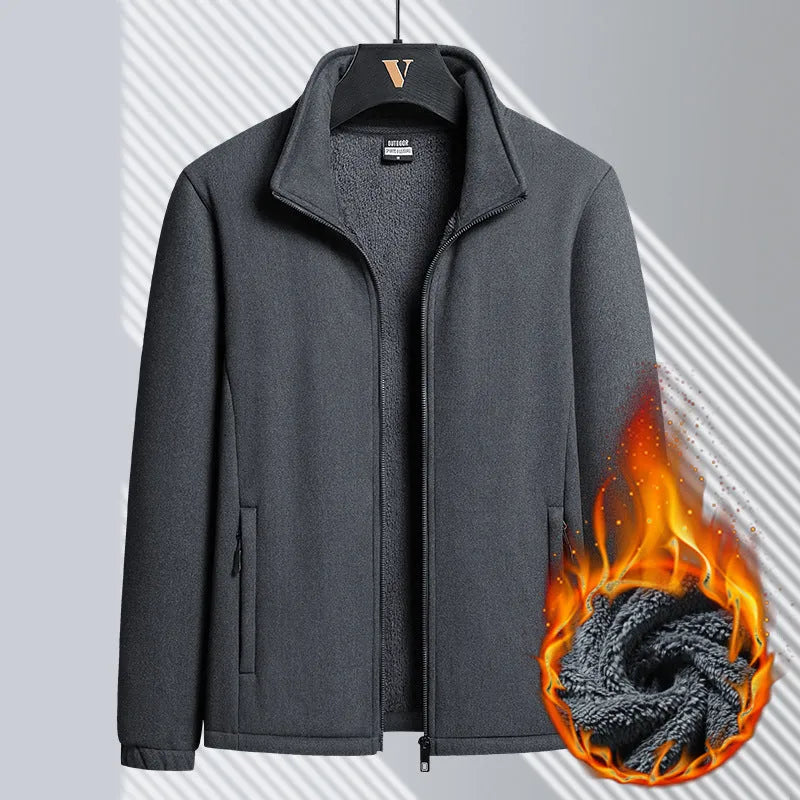 A man wearing a grey fleece-lined Berber cardigan coat with a stand-up collar and zippered pockets.