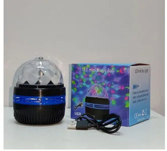 USB-powered LED galaxy projector lamp with rotating ball on a table, showing starry light projection.
