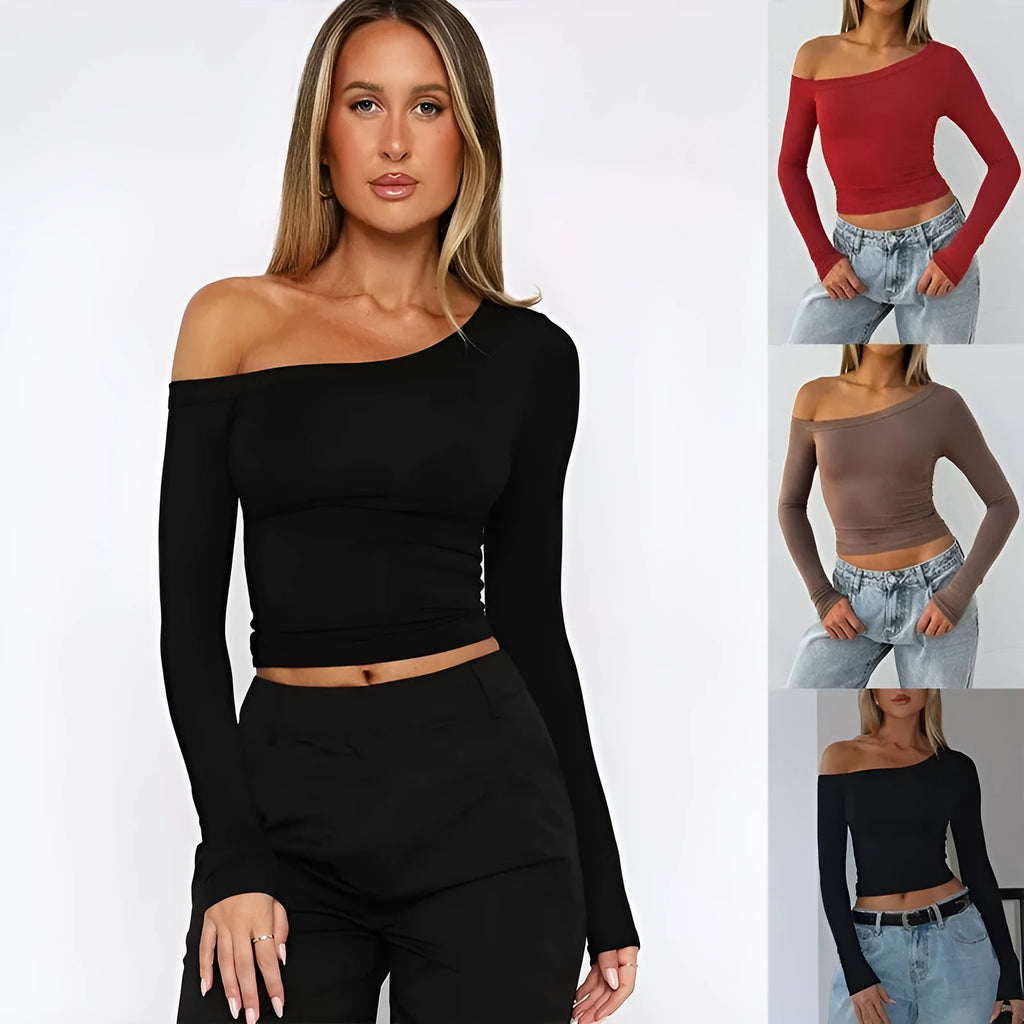 Women's slim fit long-sleeved knitted cardigan in black with cross shoulder strap detail.