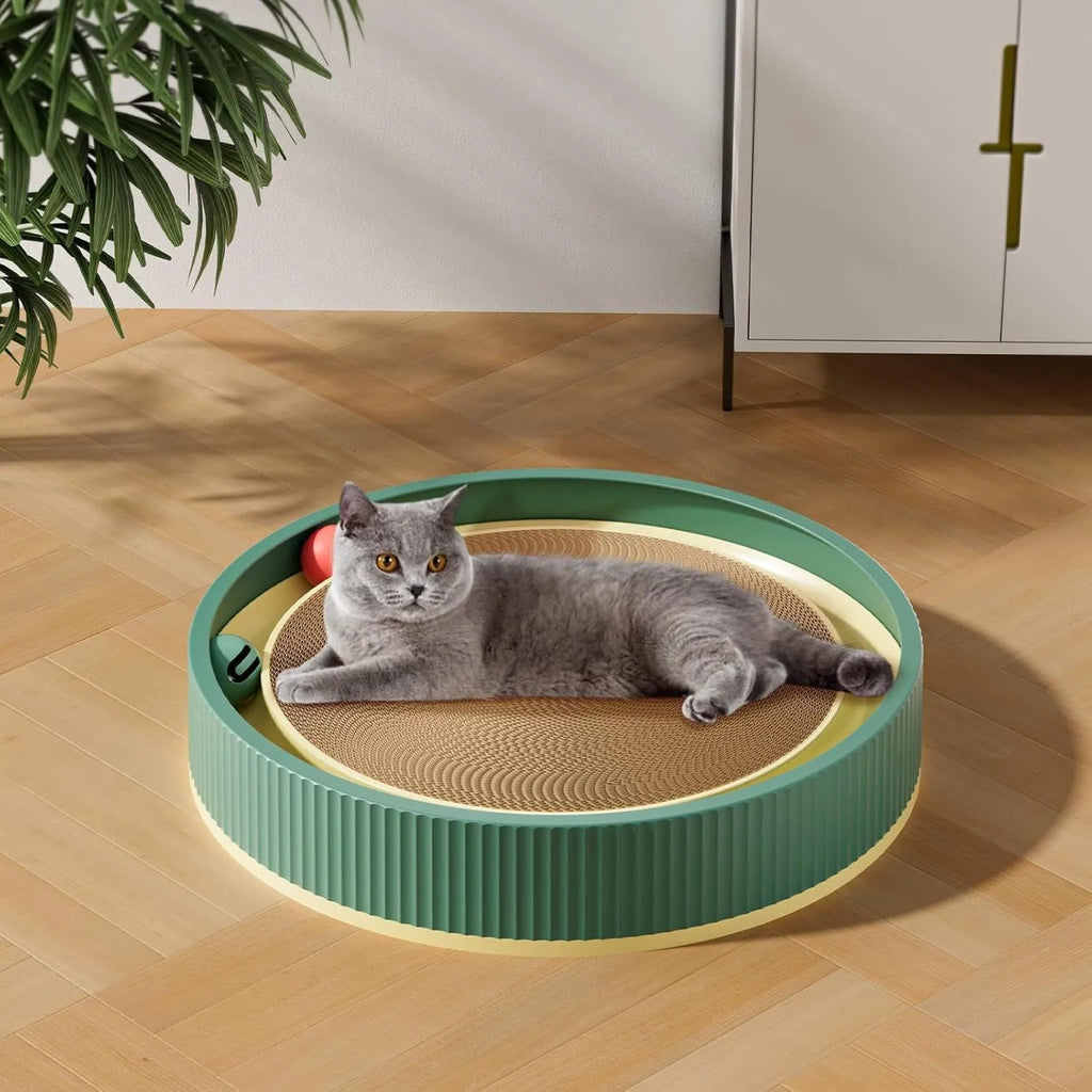 Large green circular cat scratching board with ball toys and a white replaceable core for indoor cats