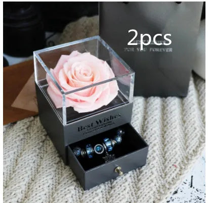 Eternal Flower gift box with preserved roses and carnations inside, measuring 8.5 cm square by 10.5 cm high