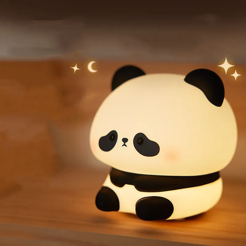 Cartoon panda head rechargeable night light with warm white glow on bedside table