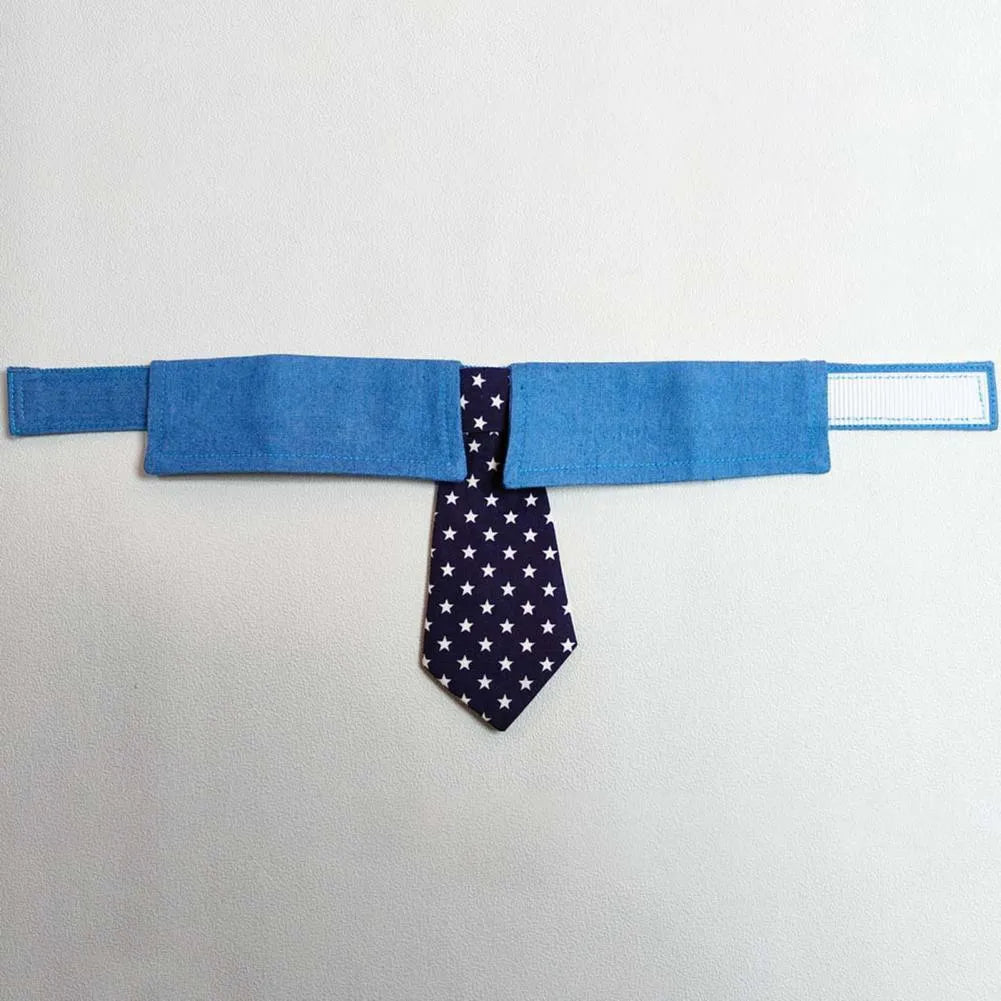 Blue denim adjustable dog collar with a black bow tie featuring white star patterns.