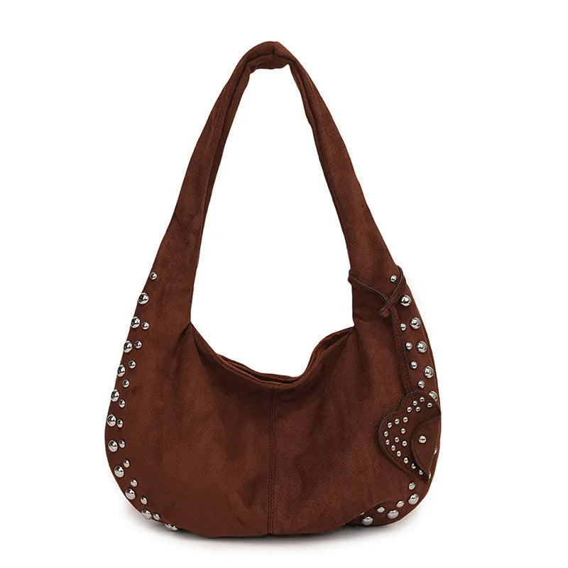 Soft plush retro style tote handbag for women in a choice of colours, shown as a strapless design.