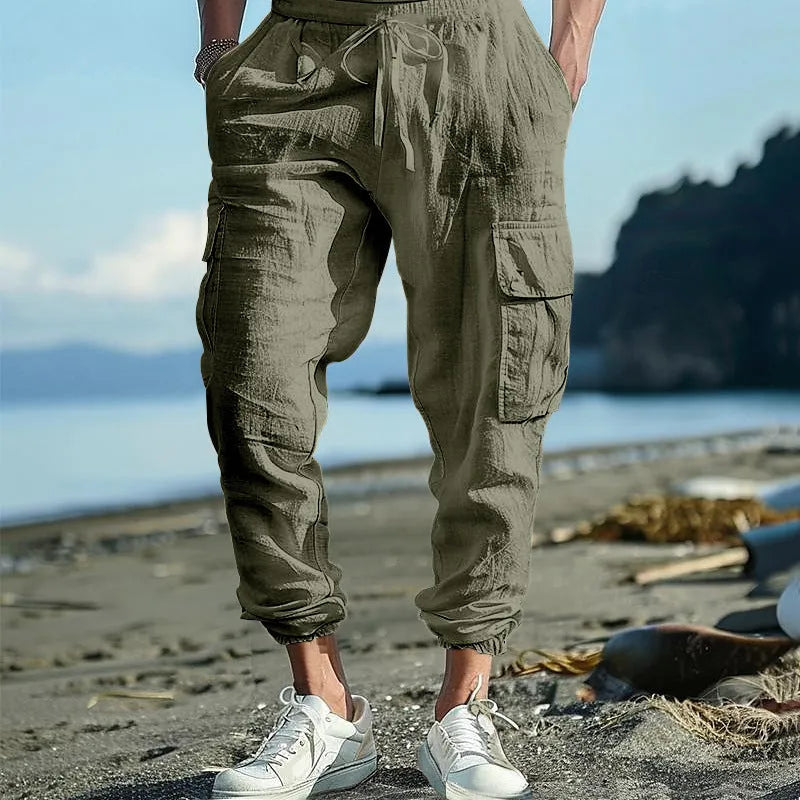 Men's linen casual trousers with ankle-tied design and multiple pockets in army green colour.