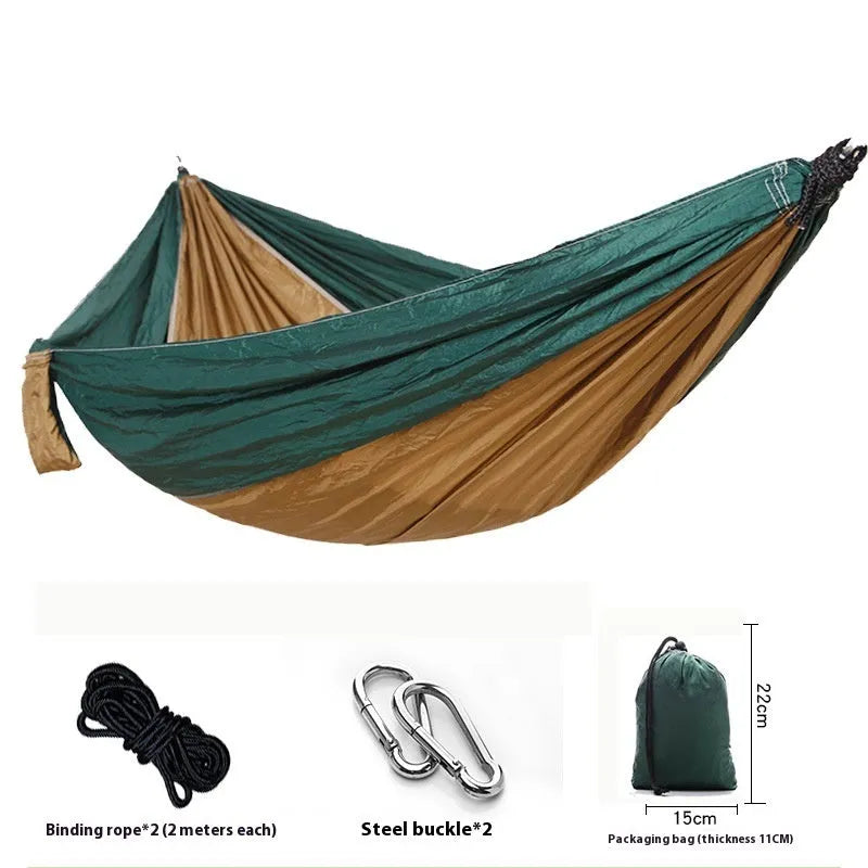 Double camping hammock with ropes and buckles shown in outdoor setting