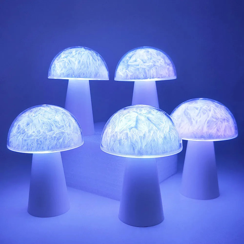 Small white mushroom-shaped decorative night light with RGB colours, remote control, on a wooden table.