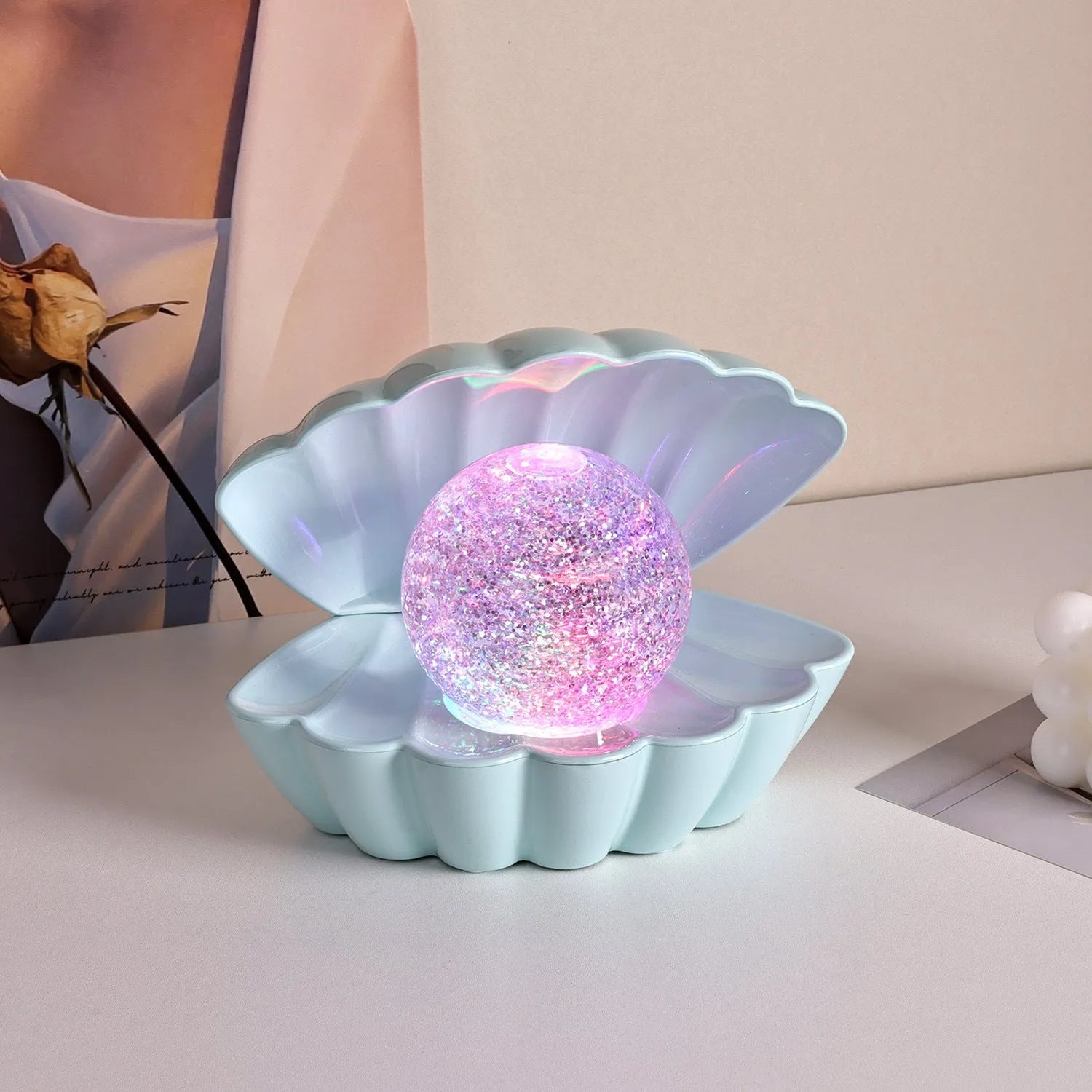 Shell-shaped decorative night lamp with neon ambience lighting in three colour variations