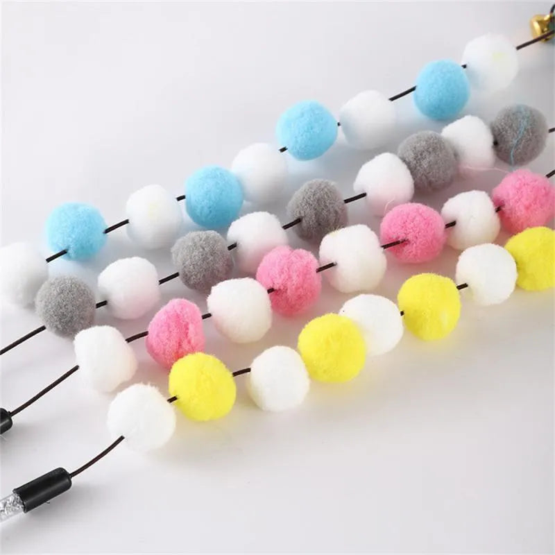 31 cm long cat teaser toy rod with bell and pompon feather attachments in blue colour