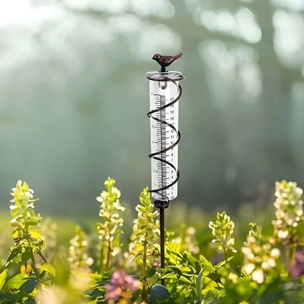 Cast iron garden rain gauge with hummingbird design showing 0-800ml water capacity