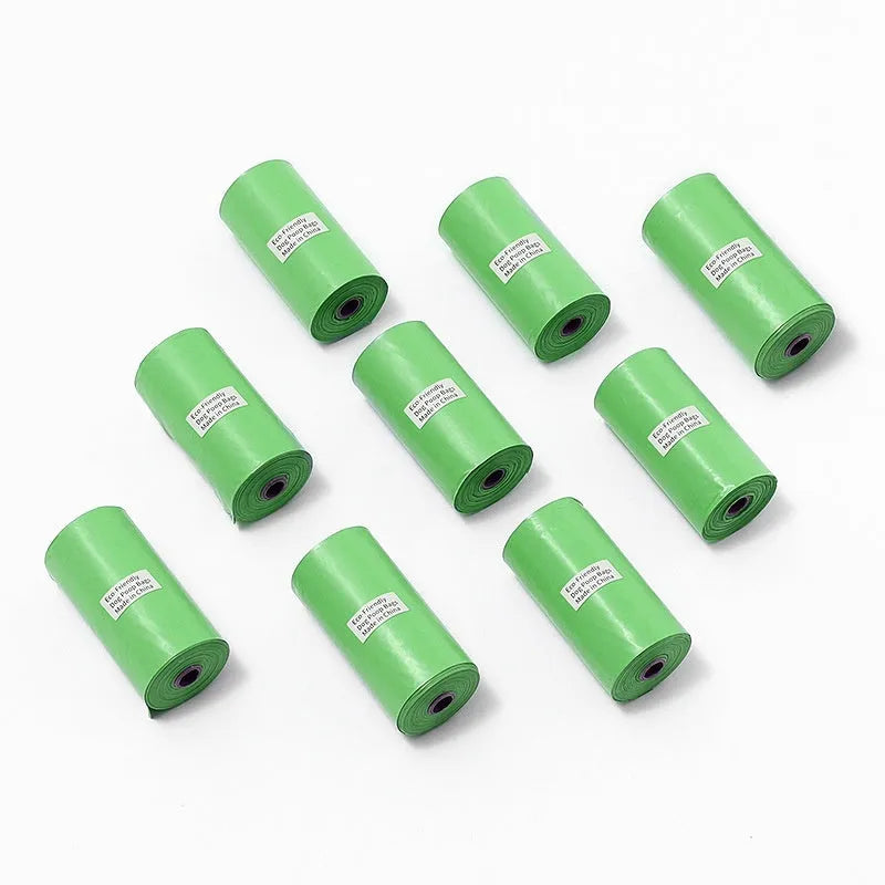 Rolls of green, black, blue, purple and orange degradable pet poo bags with a portable dispenser