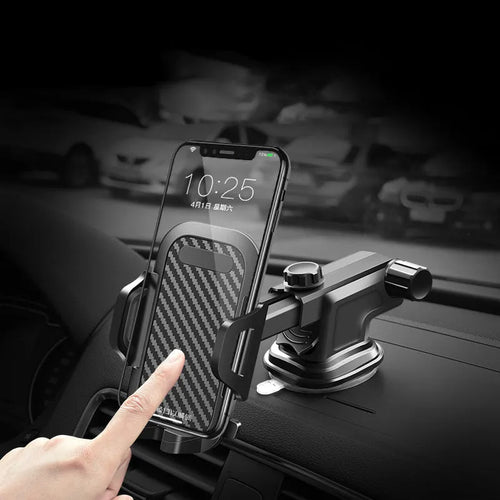 Black universal car phone holder mounted on a dashboard, showing a smartphone secured in the cradle.
