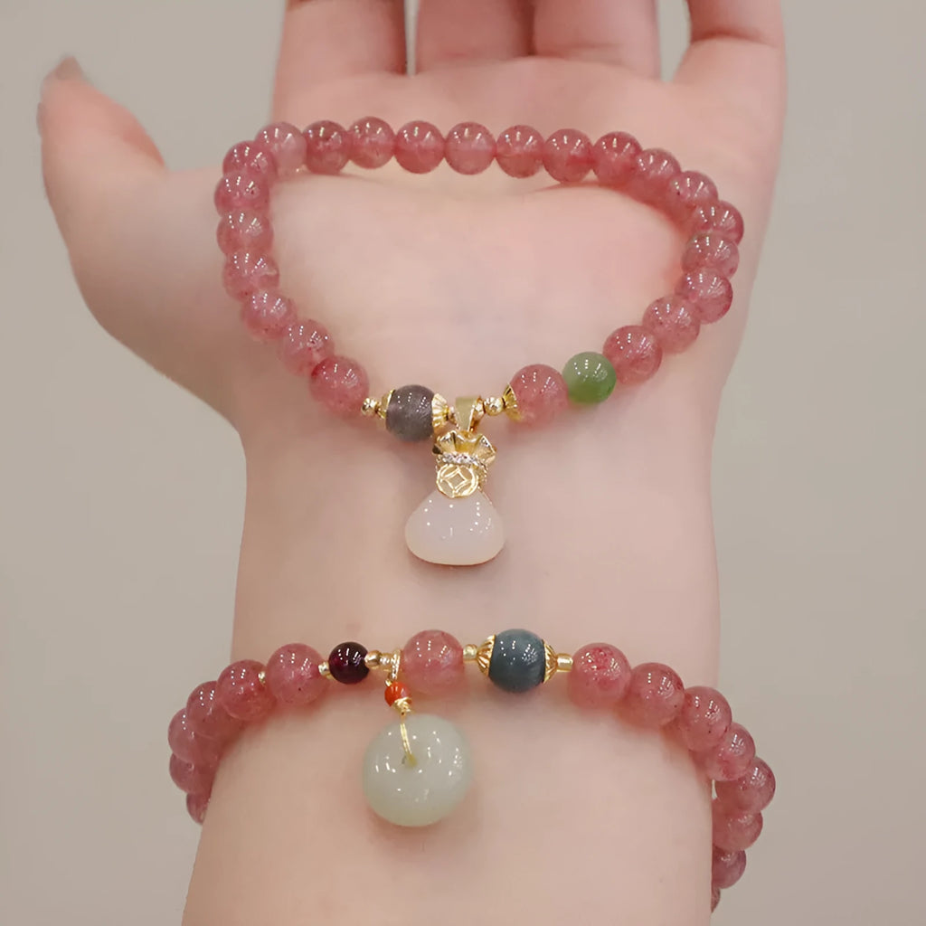 Geometric Strawberry Quartz women's bracelet with a lucky Bagg charm and a silver safety buckle clasp.