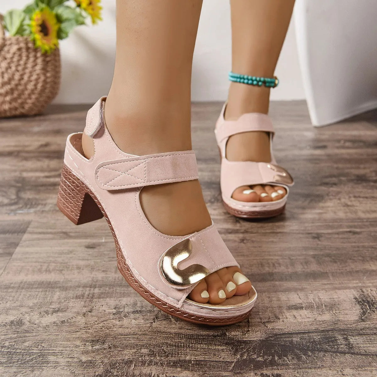 Light brown Velcro-strap Roman sandals with round toe and rubber sole on a white background.