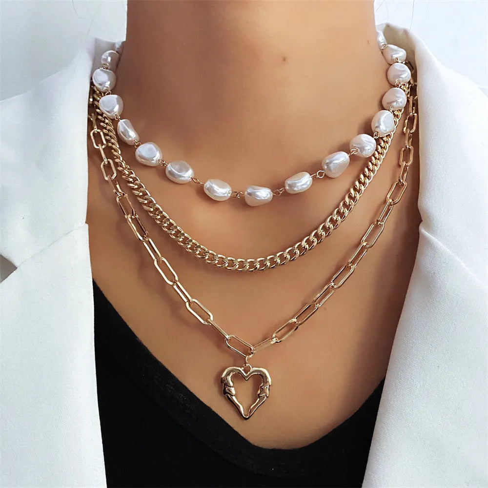 Vintage gold necklace with heart pendant on pearl-style chain, adjustable 41-50cm length