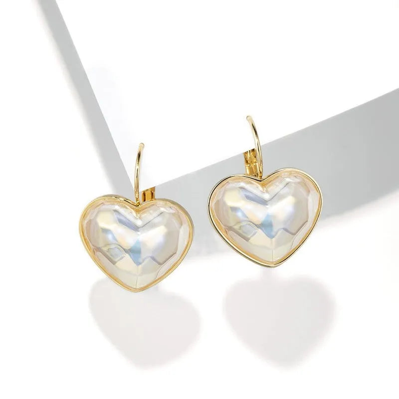 Gold summer love ear clips with alloy metal construction and clip-on design