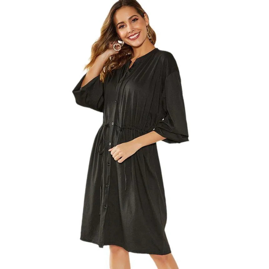 Women's black polyester dress with elastic waist, self-tie belt, and elastic cuffs on long sleeves