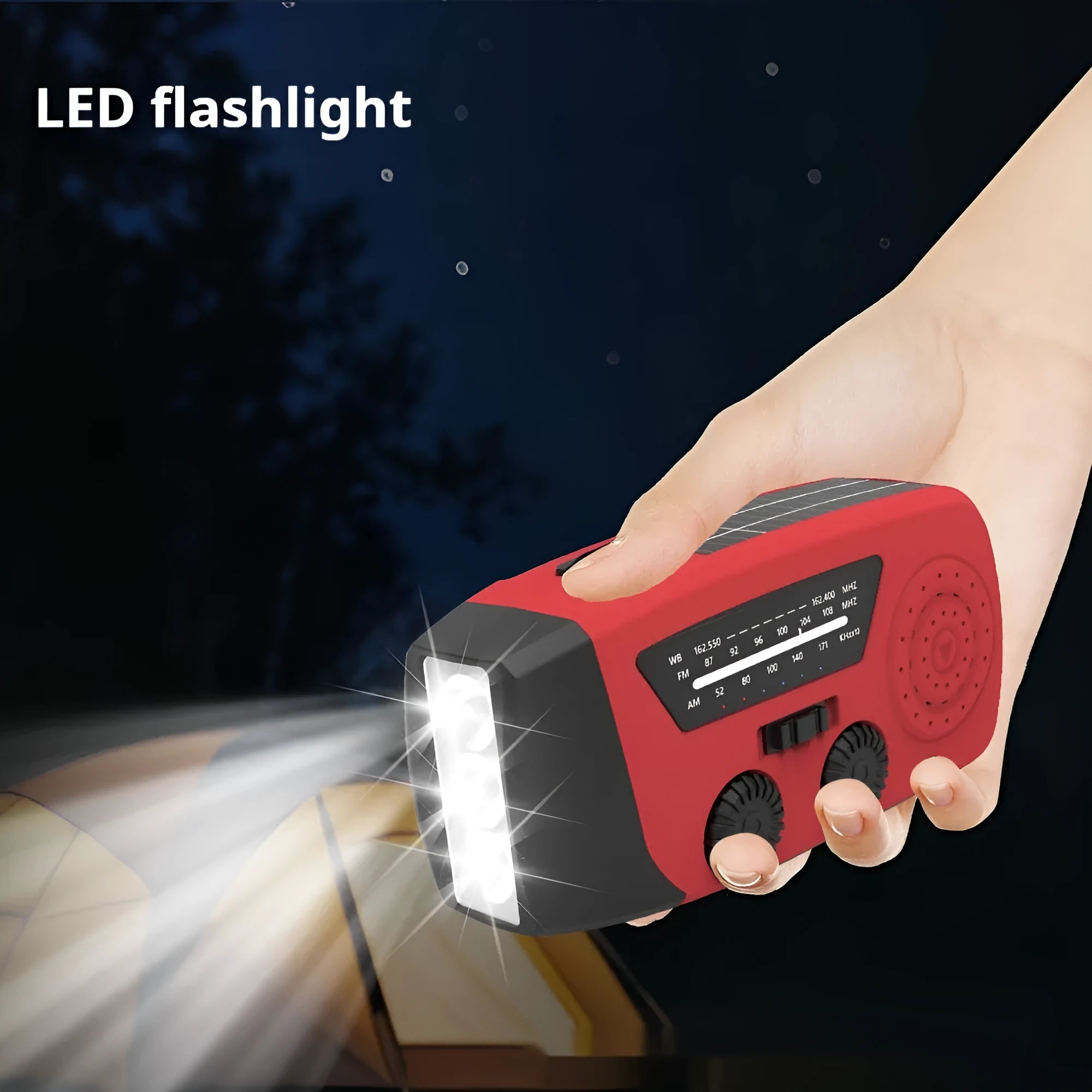 Red rechargeable hand crank emergency radio with LED torch and USB charging port.