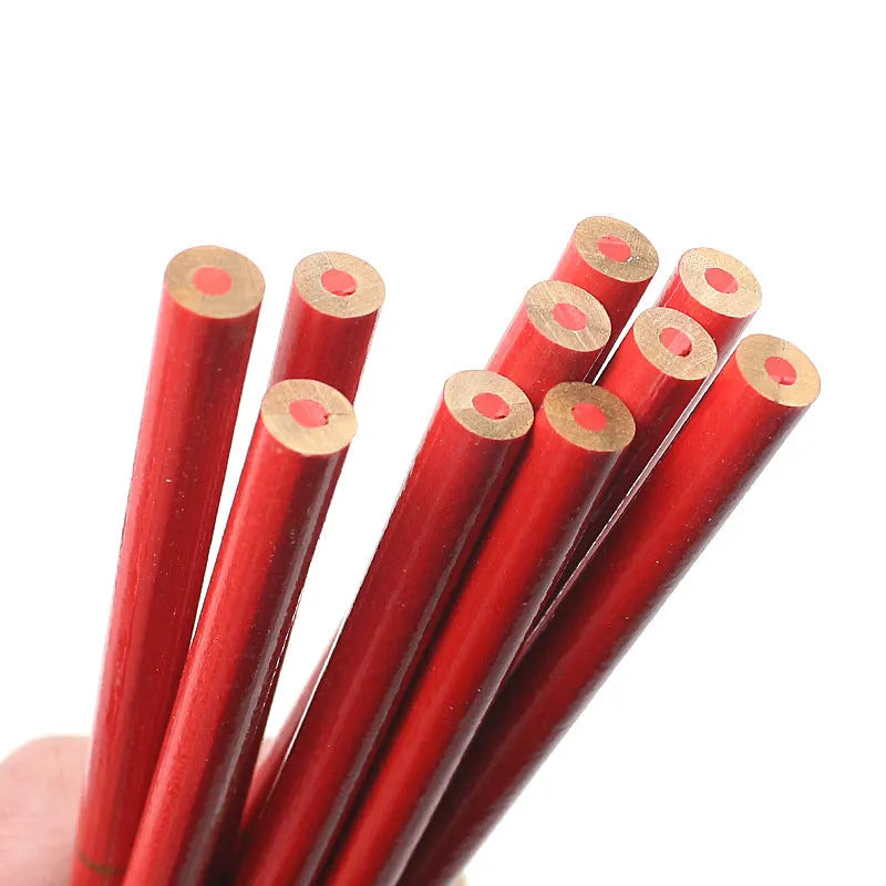 Ten red and blue wooden carpenter pencils with round barrels arranged together.
