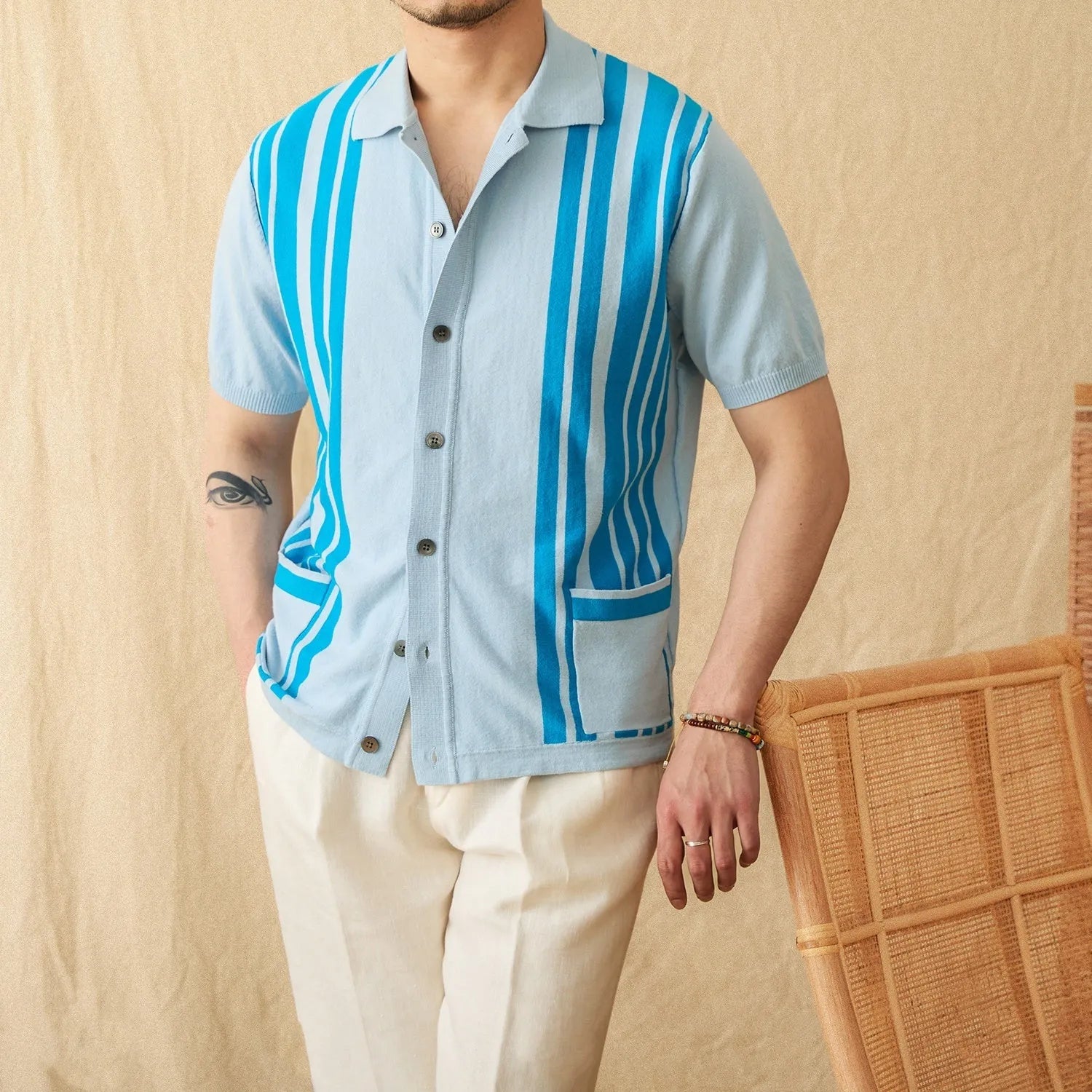 Cotton striped knitted cardigan polo shirt in light blue with lapel collar and short sleeves.