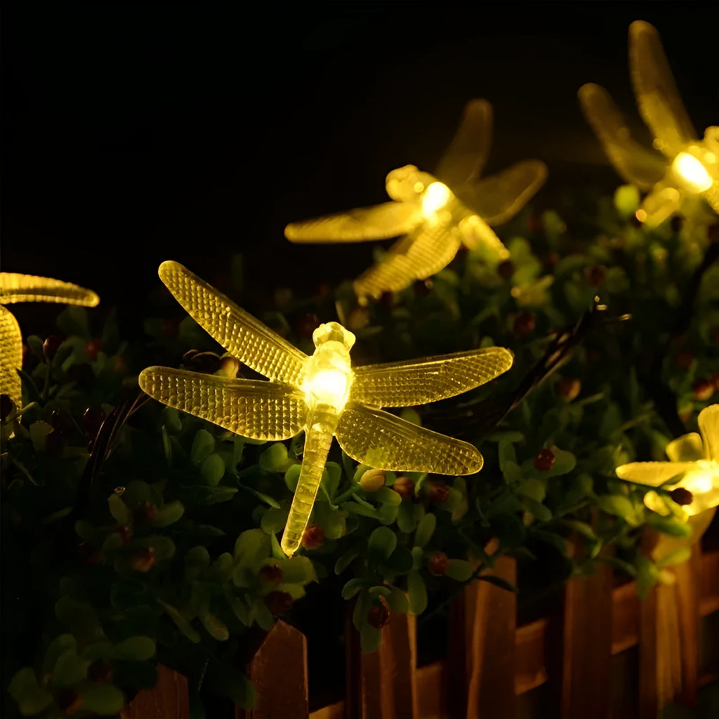 Outdoor solar LED string light with 30 warm white dragonfly lights and solar panel with ground spike