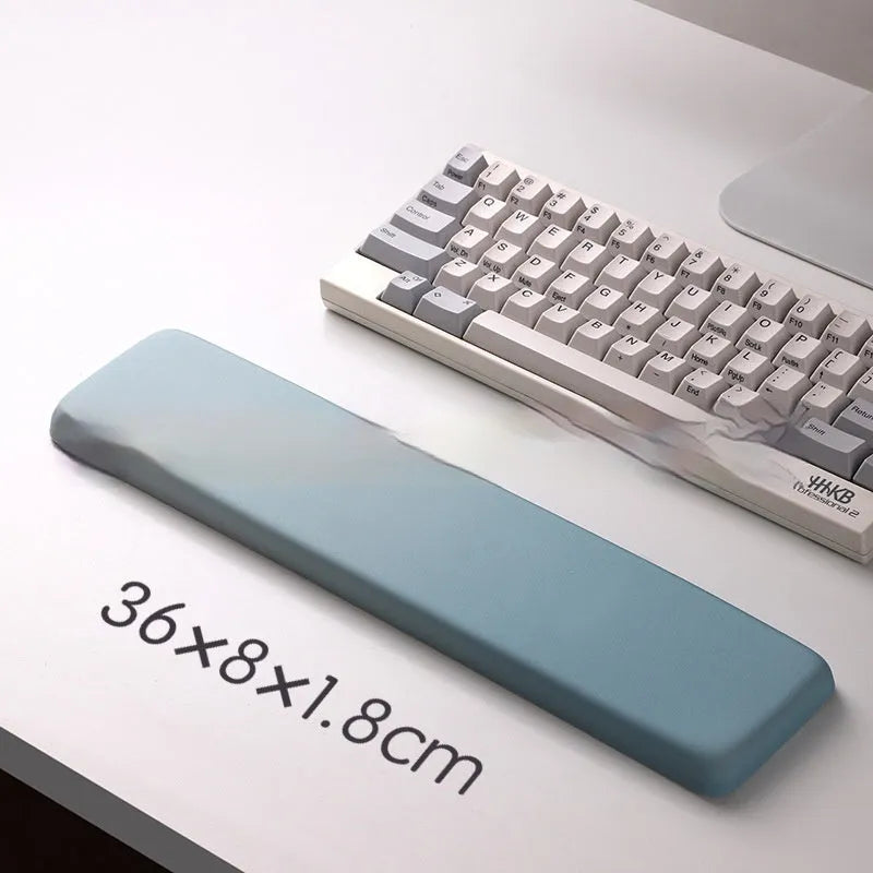 Square silicone wrist rest mouse pad with wrist strap in multiple colour options on a desk