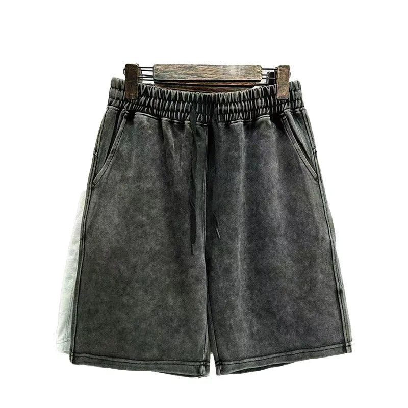 Men's straight-leg cotton casual shorts in distressed navy blue colour showing loose fit and fifth-pants length