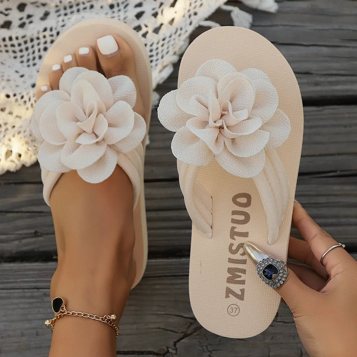 Women's floral pattern PU slippers in beige, shown in a casual flip-flop style with a round toe.