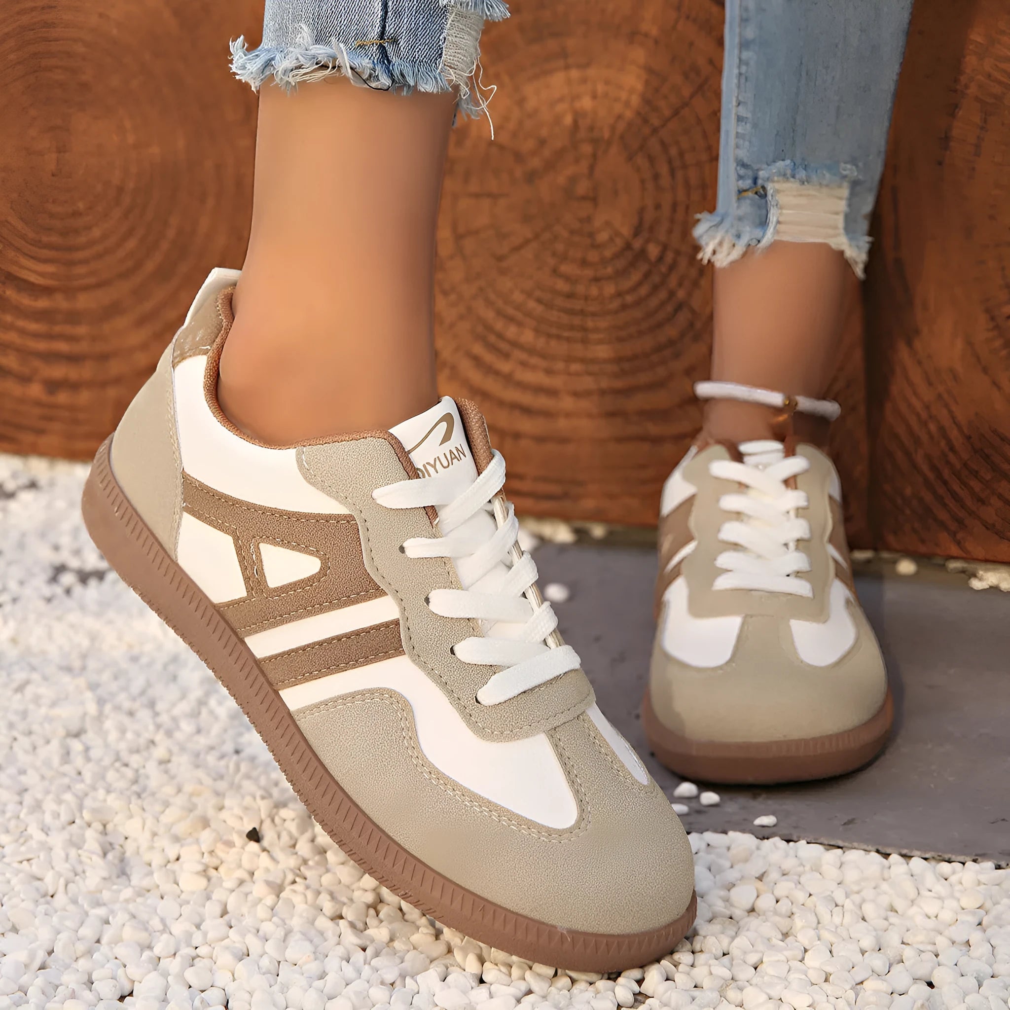 Retro women's jogging shoes in black with lace-up front, cross strap, and platform heel design