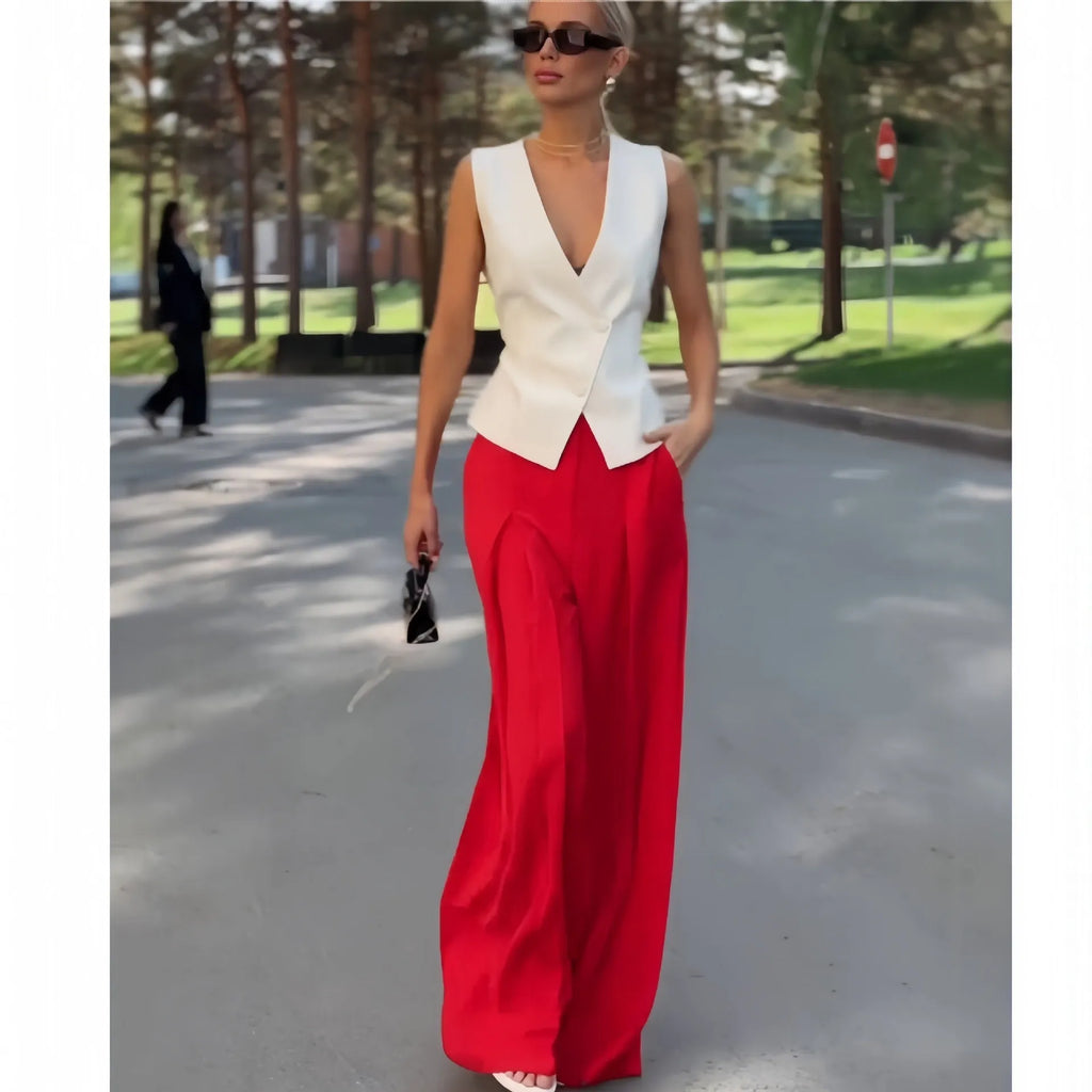 Beige women's two-piece set with deep V-neck sleeveless top and high-waist wide leg trousers
