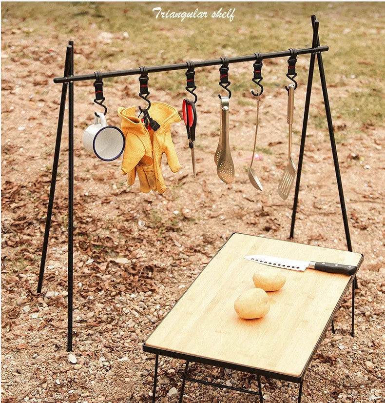Silver aluminium foldable triangle camping clothes drying rack with side hanger and multiple hooks.