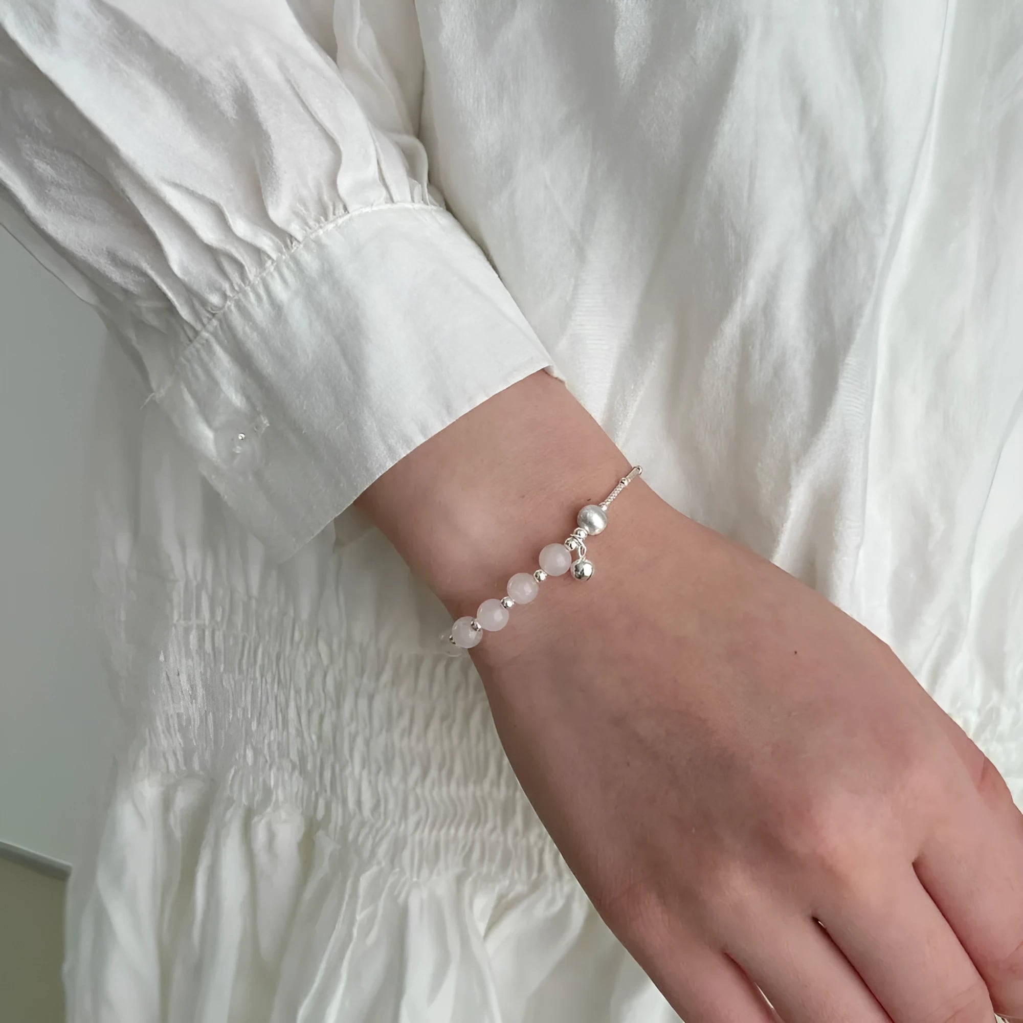 925 silver brushed ball bracelet with silver pink crystal electroplated finish on white background
