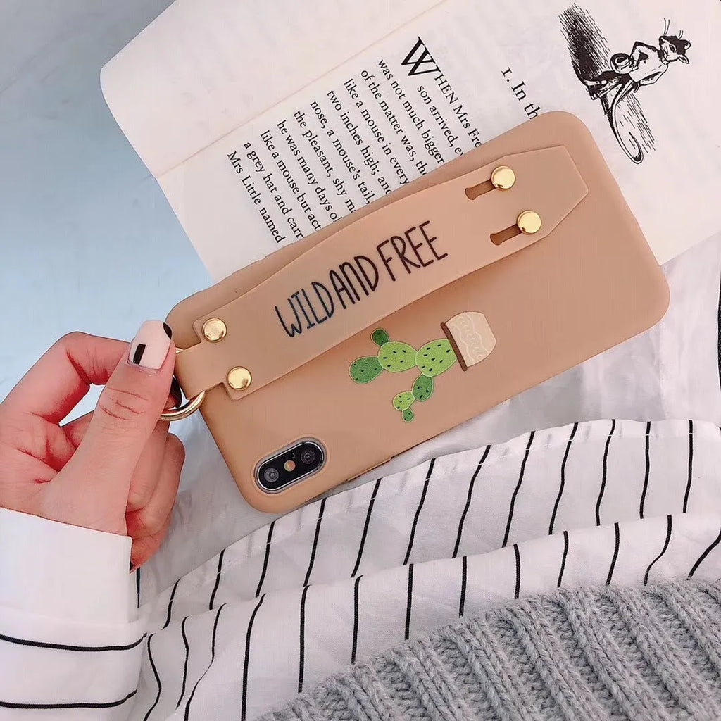 Green wristband holder phone case with graffiti design for iPhone, showing the integrated carrying loop.