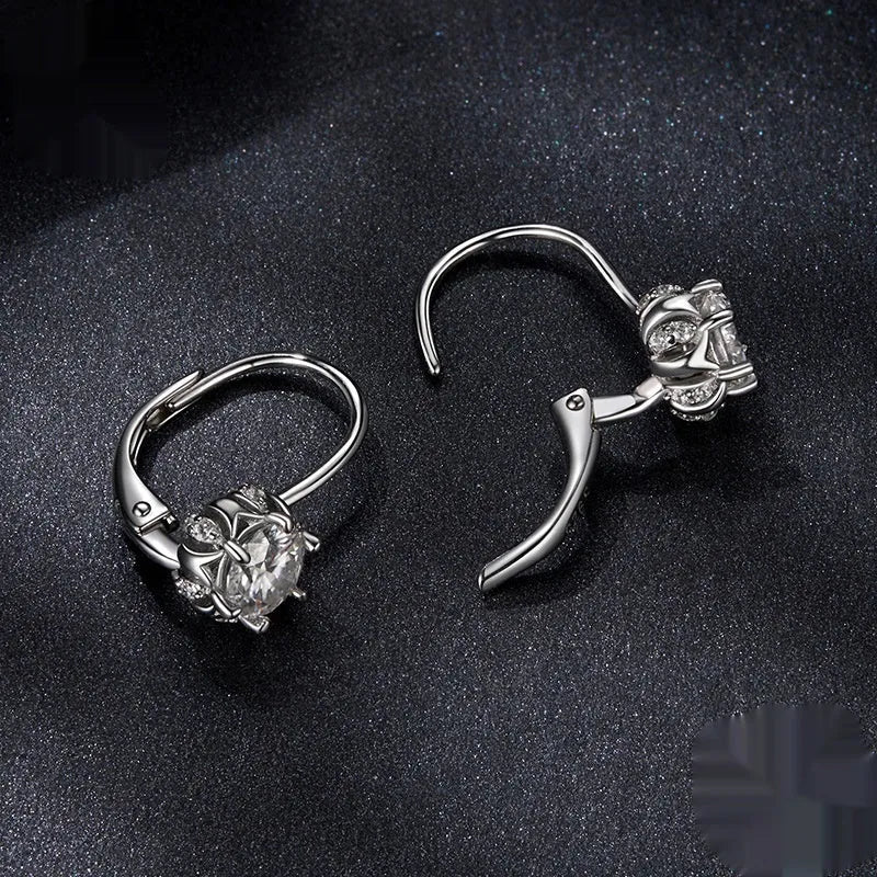 Sterling silver flower bud ear clips with white gold plating and 0.5ct moissanite stone