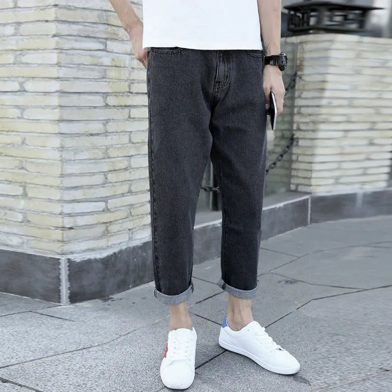Men's straight-leg jeans in cotton with loose small harem cut in black or blue colour