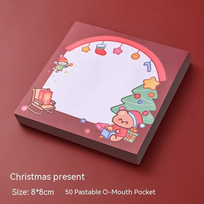 Christmas sticky notes pad showing eight festive designs including Santa Claus, elf, snowman, and gift box