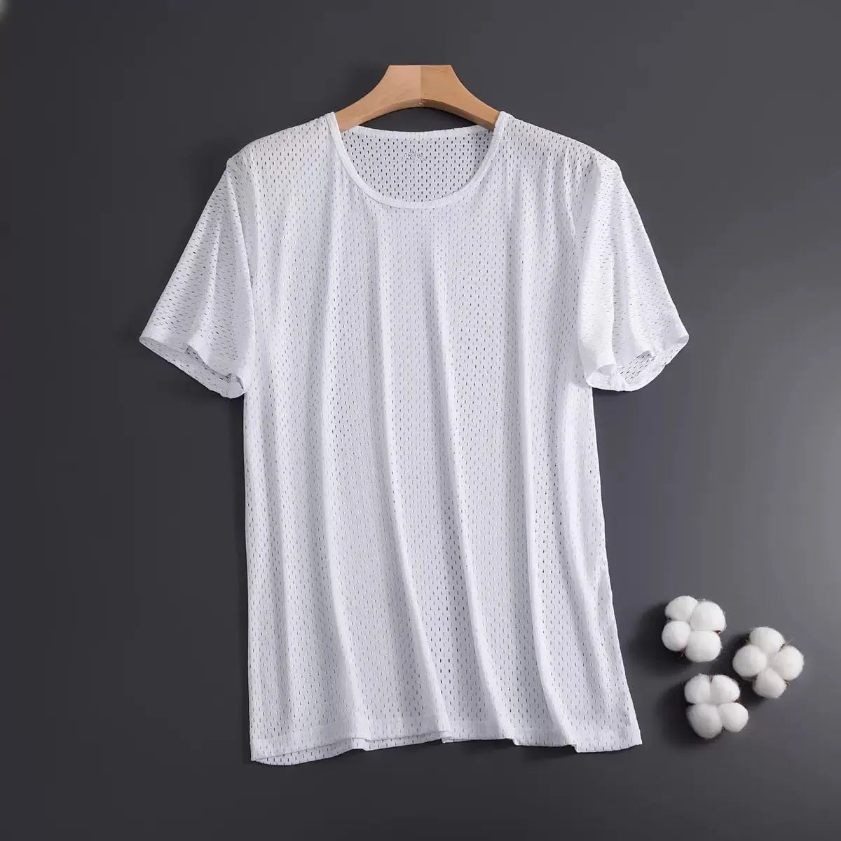 Man wearing a thin grey Ice Silk short sleeve crew neck t-shirt with a loose fit.