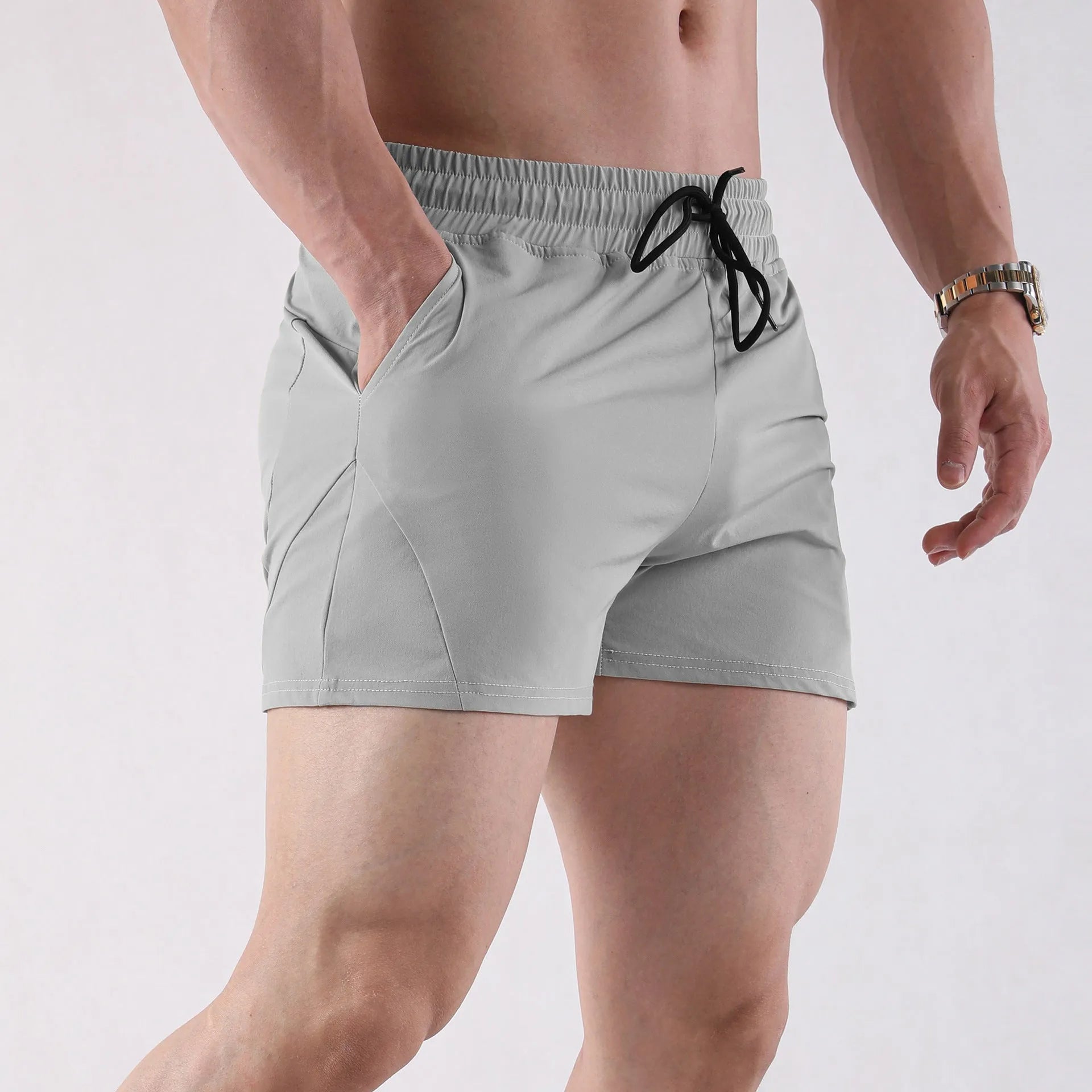 Men's lightweight polyester basketball shorts in grey, black, apricot, or green.
