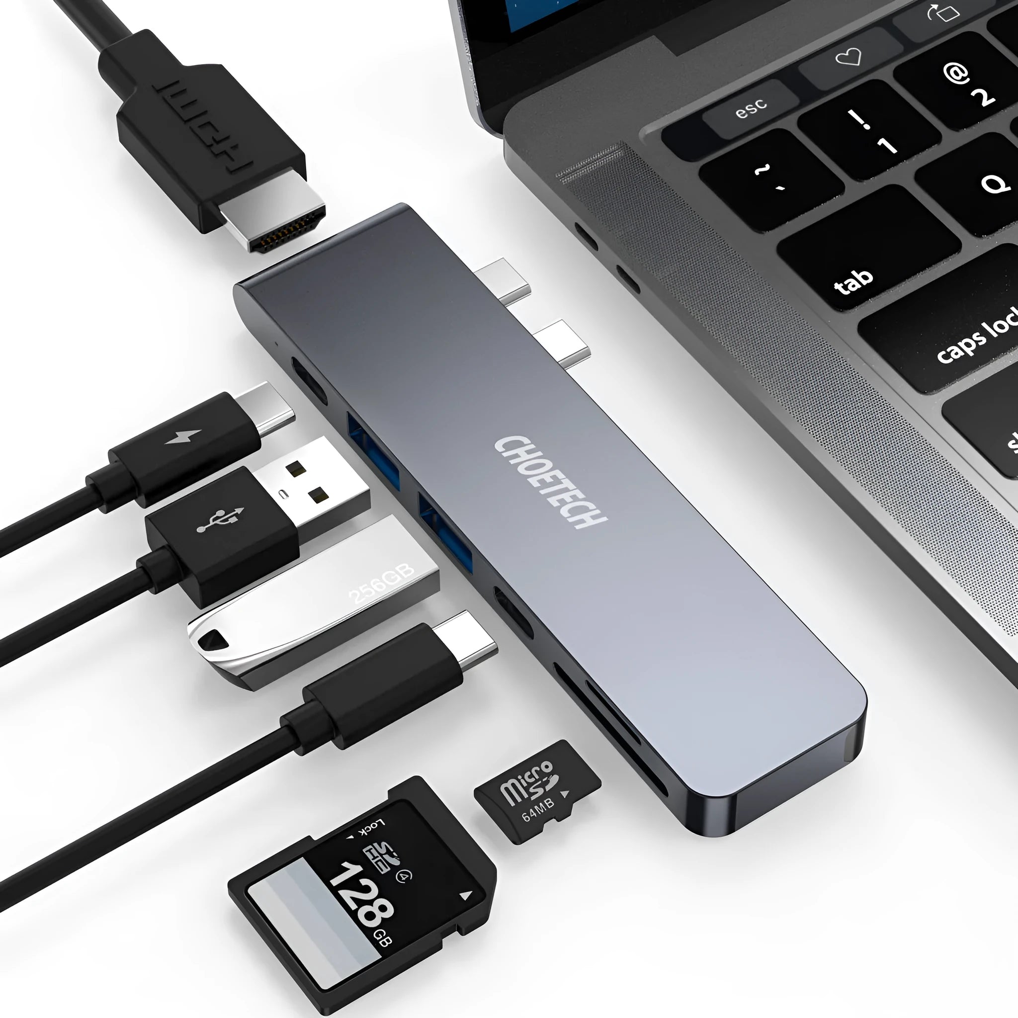 Silver aluminium USB-C multi-port adapter hub with SD card slot, HDMI, USB ports, and Power Delivery.